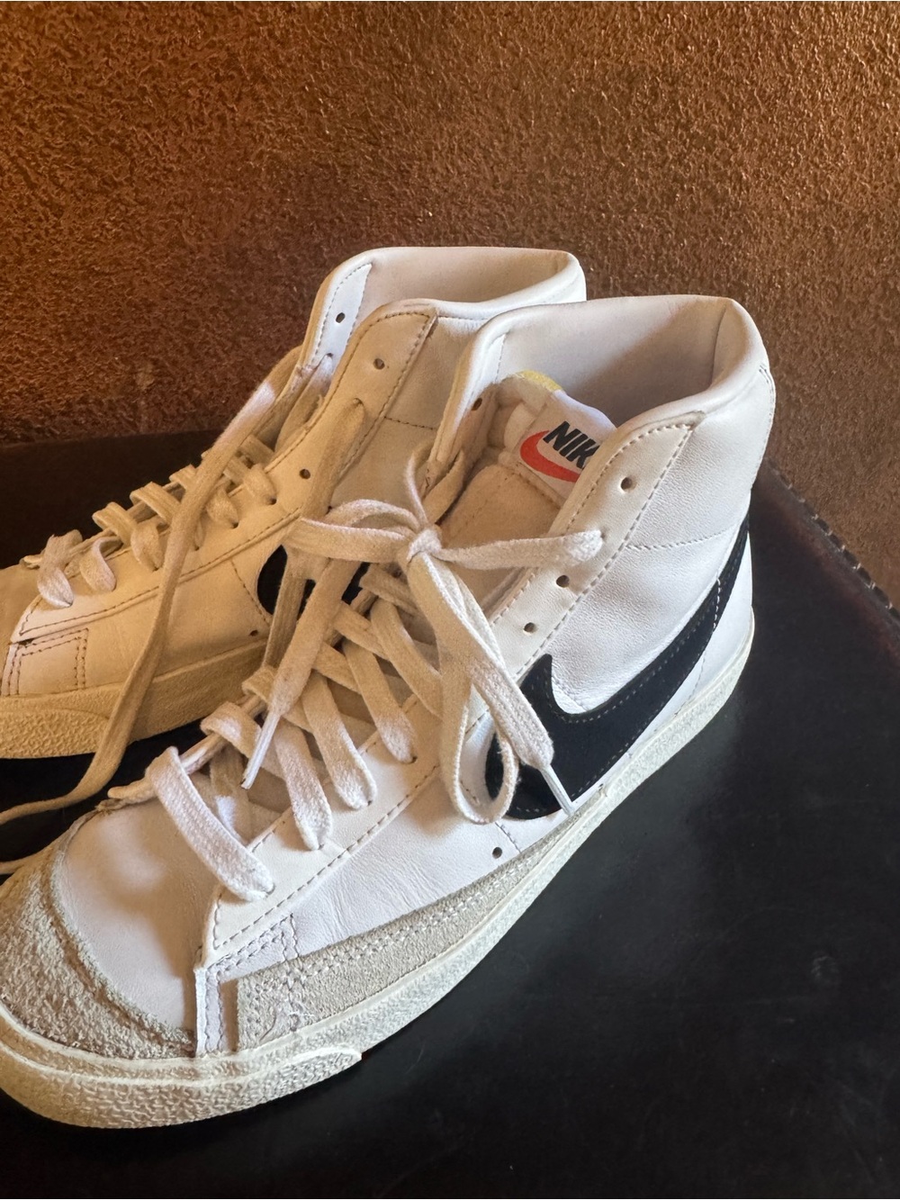 Nike White High-Top Sneakers with Black Swoosh and Cream Accents
